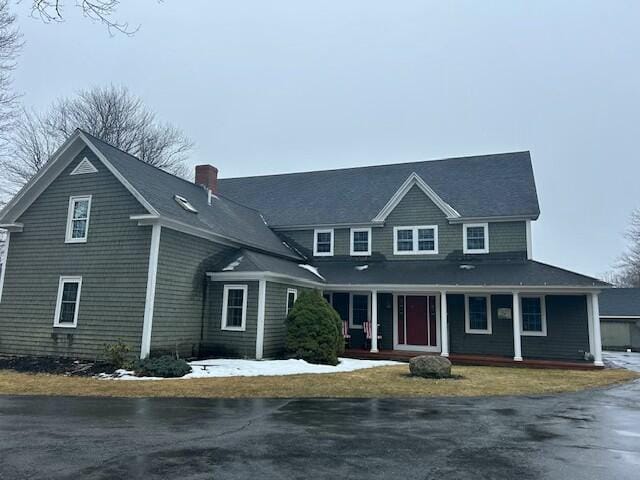 1928 Essex St, Bangor, ME 04401 - view of front of home with a chimney and covered porch