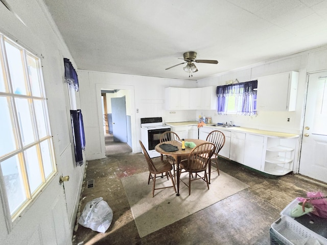 27 Cannard St, Gardiner, ME 04345 - dining space featuring a ceiling fan