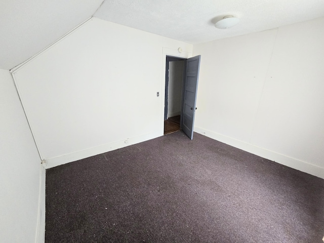 27 Cannard St, Gardiner, ME 04345 - unfurnished room with baseboards and vaulted ceiling