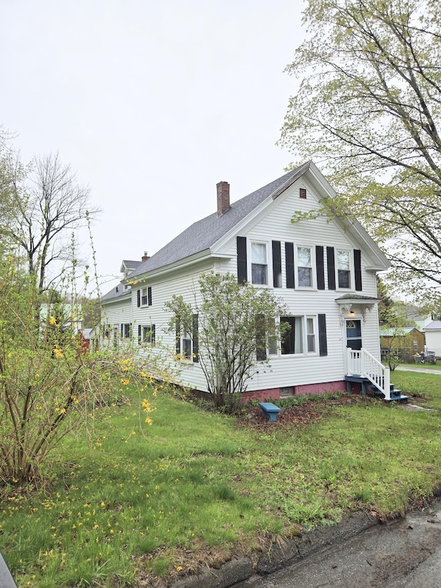 27 Cannard St, Gardiner, ME 04345 - view of side of property featuring a chimney and a yard