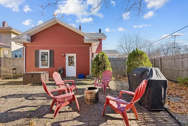 218 Bradley St, Portland, ME 04103 - back of house featuring a fenced backyard, a fire pit, and a patio area