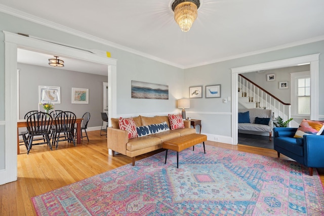 218 Bradley St, Portland, ME 04103 - living area with wood finished floors, stairs, ornamental molding, and baseboards