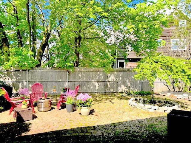 218 Bradley St, Portland, ME 04103 - fenced backyard featuring a patio area