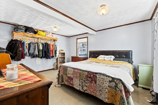 carpeted bedroom featuring crown molding and baseboards