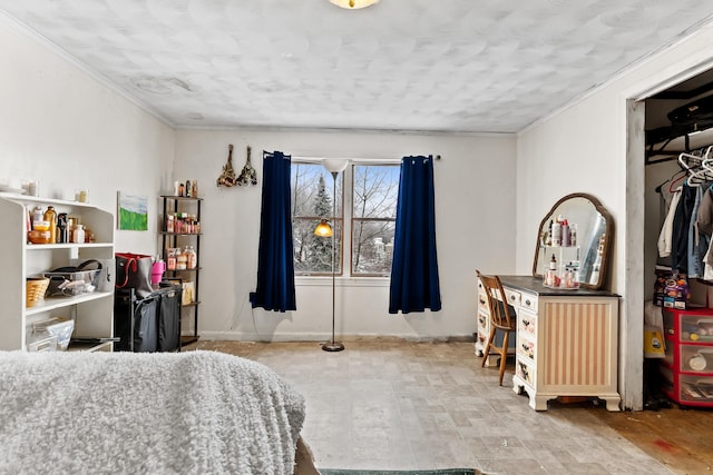 bedroom with baseboards and crown molding