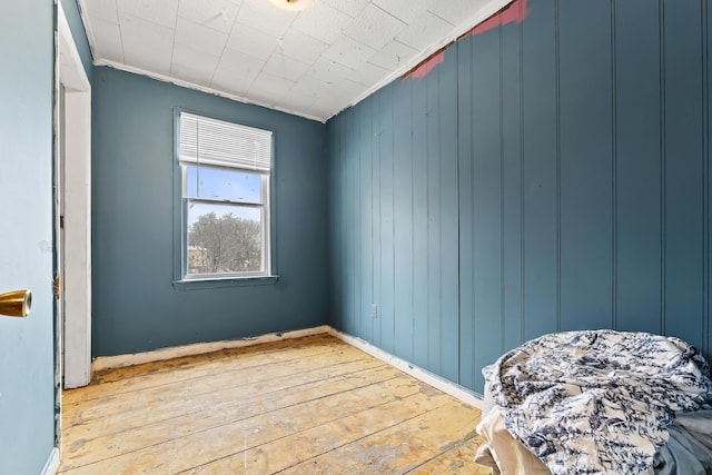 bedroom with wood-type flooring