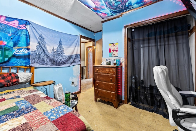 bedroom featuring ornamental molding and carpet