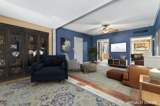 living room featuring wood finished floors and a ceiling fan