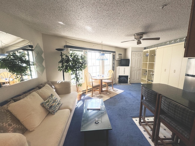 298 Main St Unit 209, Ogunquit, ME 03907 - living area with a ceiling fan, carpet floors, and a textured ceiling