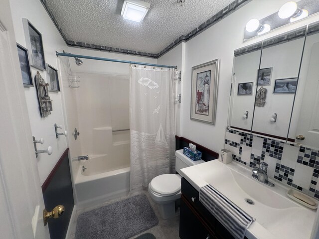 298 Main St Unit 209, Ogunquit, ME 03907 - bathroom with vanity, shower / tub combo with curtain, toilet, a textured ceiling, and backsplash