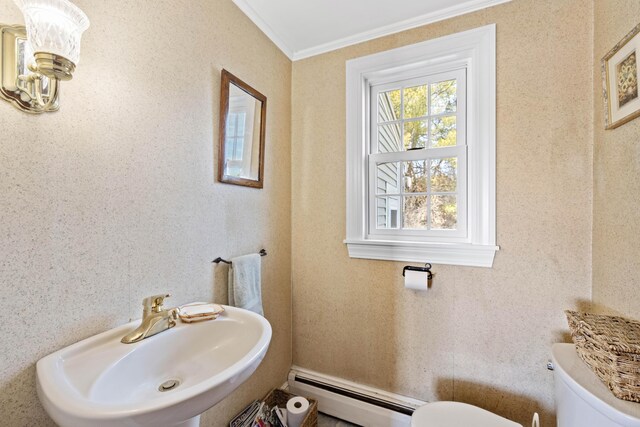 227 Greely Rd, Cumberland, ME 04021 - half bathroom with ornamental molding, toilet, a baseboard heating unit, and a sink