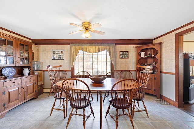 227 Greely Rd, Cumberland, ME 04021 - dining area featuring wainscoting, a baseboard heating unit, ornamental molding, and a ceiling fan