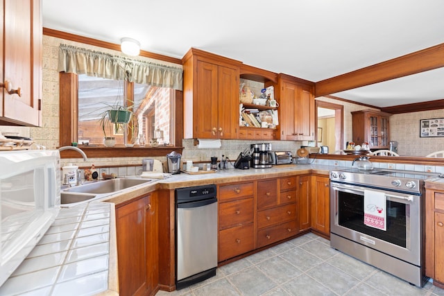 227 Greely Rd, Cumberland, ME 04021 - kitchen with tasteful backsplash, crown molding, electric stove, a sink, and brown cabinetry
