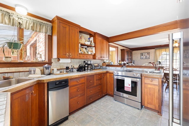 227 Greely Rd, Cumberland, ME 04021 - kitchen with backsplash, brown cabinetry, and electric stove