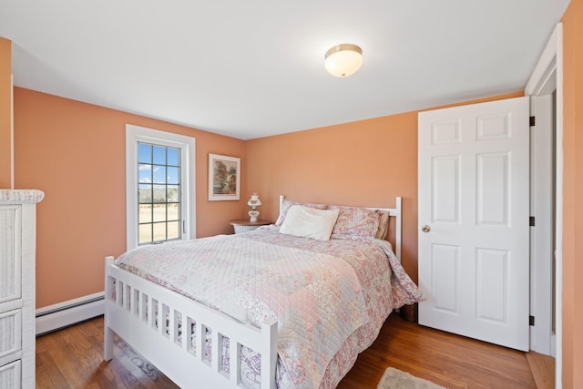 227 Greely Rd, Cumberland, ME 04021 - bedroom with wood finished floors and baseboard heating