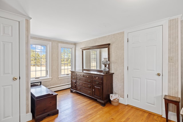 227 Greely Rd, Cumberland, ME 04021 - bedroom with light wood finished floors, wallpapered walls, multiple windows, and a baseboard radiator