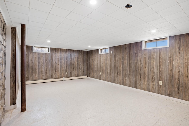 227 Greely Rd, Cumberland, ME 04021 - basement with wood walls, recessed lighting, baseboards, tile patterned floors, and a baseboard radiator