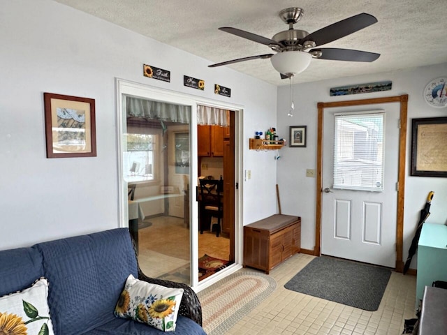 1873 Sly Brook Rd, Eagle Lake, ME 04739 - entrance foyer with light tile patterned flooring, a textured ceiling, plenty of natural light, and ceiling fan