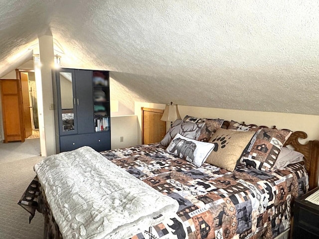 1873 Sly Brook Rd, Eagle Lake, ME 04739 - carpeted bedroom with a textured ceiling and vaulted ceiling