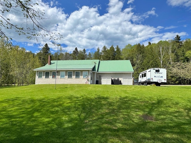 1873 Sly Brook Rd, Eagle Lake, ME 04739 - rear view of property featuring a yard, a chimney, and metal roof
