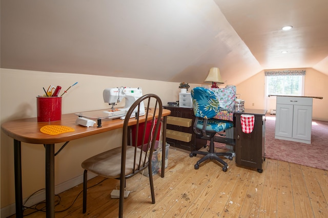 home office featuring lofted ceiling, light wood finished floors, and recessed lighting