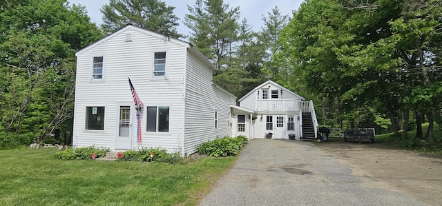 749 W River Rd, Waterville, ME 04901 - view of front of house with driveway, stairway, a front yard, and view of wooded area