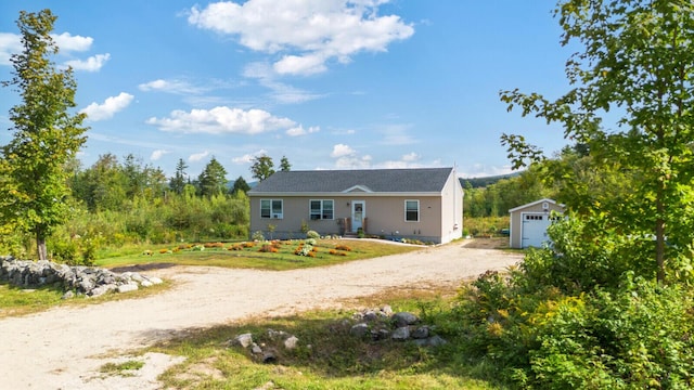 view of front facade with driveway and an outdoor structure