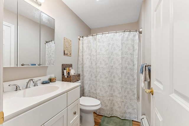 full bathroom featuring a baseboard radiator, wood finished floors, toilet, and vanity