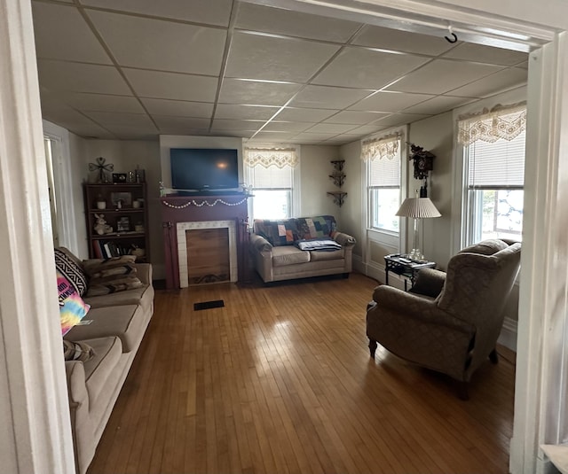 230 Center St, Brewer, ME 04412 - living room with hardwood / wood-style flooring, a drop ceiling, and baseboards