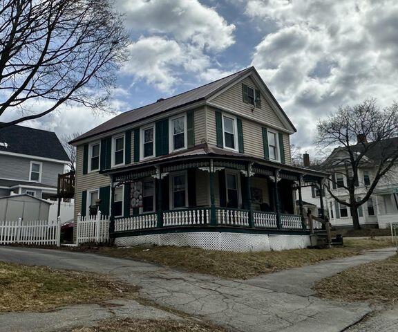 230 Center St, Brewer, ME 04412 - view of front of home featuring a porch and fence