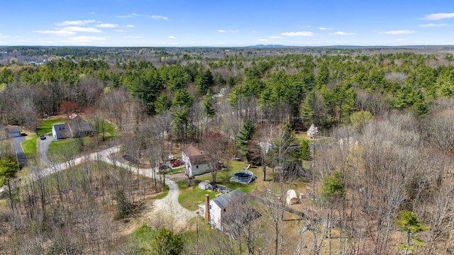 bird's eye view featuring a wooded view