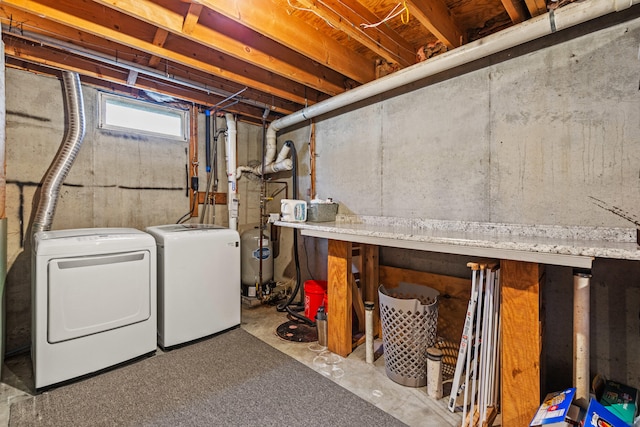 basement with washer and clothes dryer