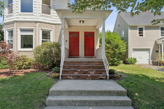 23-25 Deerfield Rd, Portland, ME 04101 - property entrance with a garage and a yard