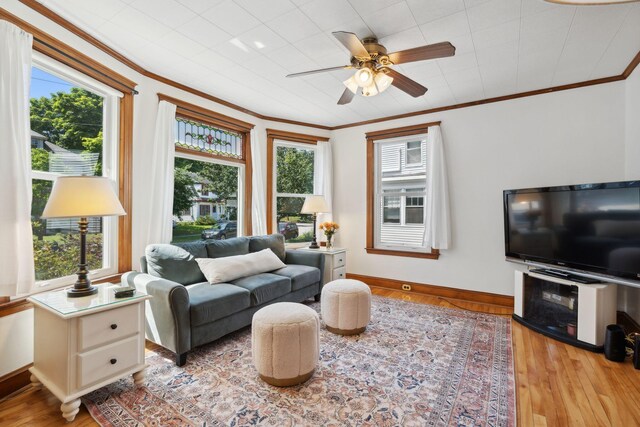 23-25 Deerfield Rd, Portland, ME 04101 - living area featuring plenty of natural light, a ceiling fan, wood finished floors, baseboards, and ornamental molding