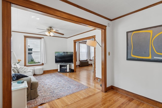 23-25 Deerfield Rd, Portland, ME 04101 - living area featuring radiator heating unit, ornamental molding, hardwood / wood-style flooring, baseboards, and ceiling fan