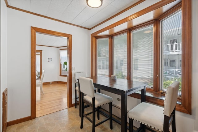 23-25 Deerfield Rd, Portland, ME 04101 - dining area featuring ornamental molding and baseboards