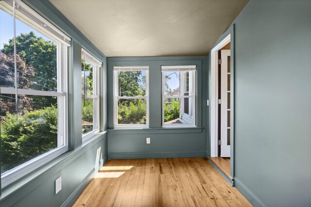 23-25 Deerfield Rd, Portland, ME 04101 - unfurnished sunroom with hardwood / wood-style flooring and baseboards