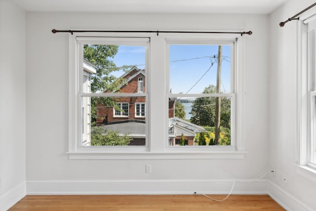 23-25 Deerfield Rd, Portland, ME 04101 - empty room with light wood-style floors and baseboards
