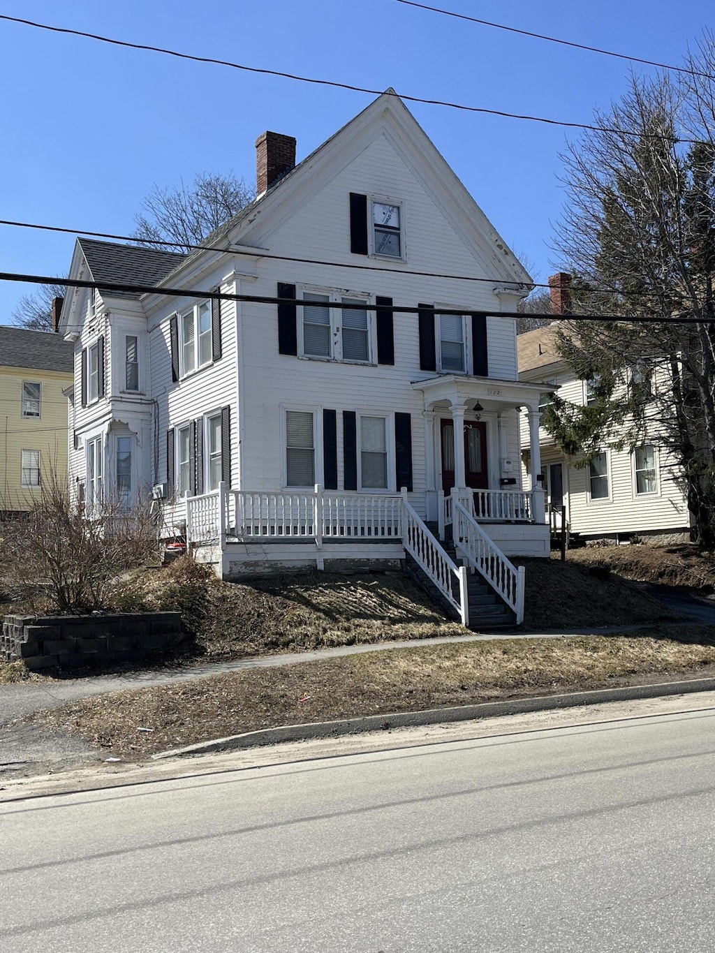 122 Ohio St, Bangor, ME 04401 - view of front of home with a porch and a chimney