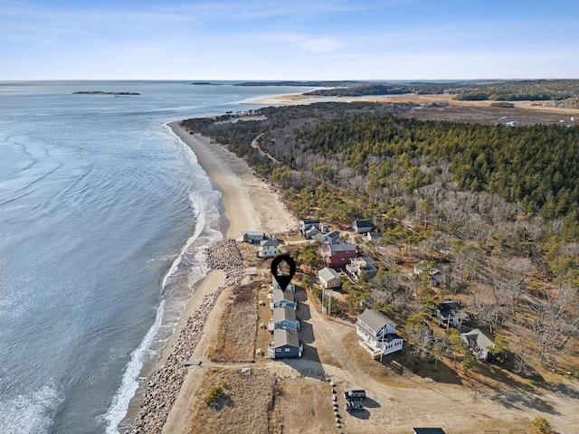 bird's eye view with a water view and a beach view