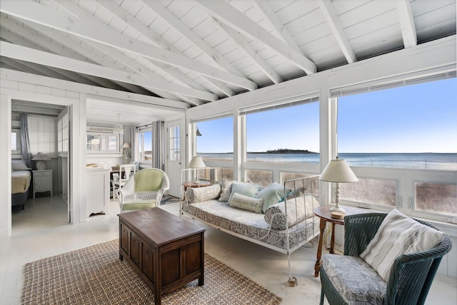 sunroom featuring a water view, wooden ceiling, and vaulted ceiling with beams