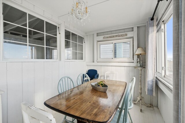 dining space with a notable chandelier