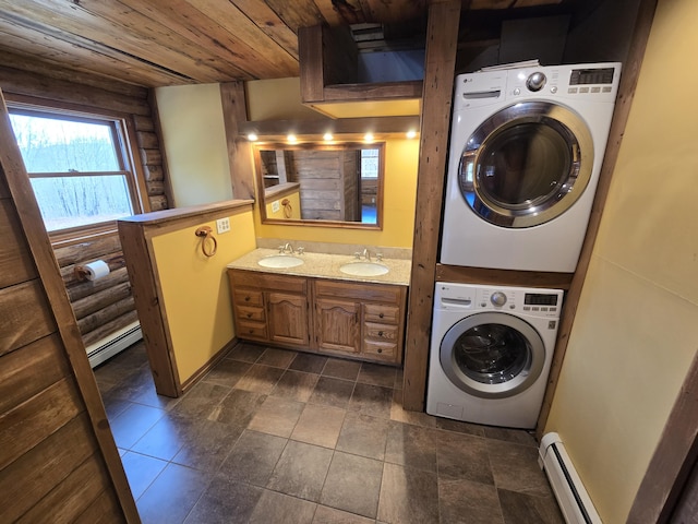 369 Hawes Bridge Rd, Prospect, ME 04981 - laundry room with baseboard heating, stacked washer and clothes dryer, and wood ceiling