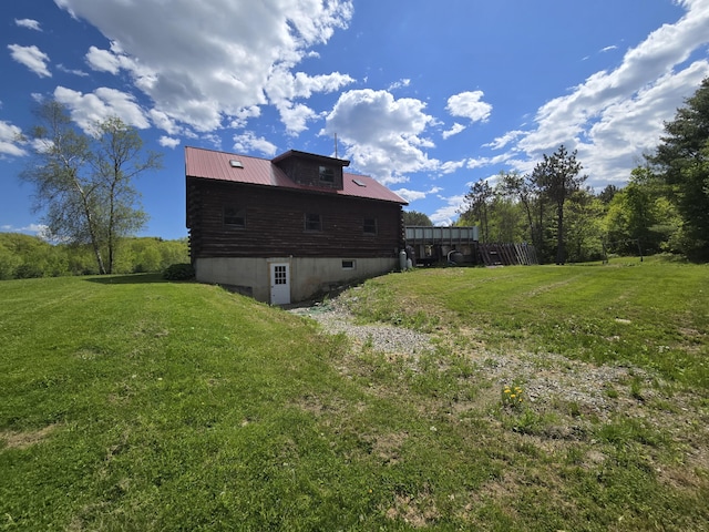 369 Hawes Bridge Rd, Prospect, ME 04981 - back of house featuring metal roof and a lawn