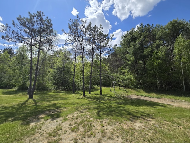 369 Hawes Bridge Rd, Prospect, ME 04981 - view of green lawn with a wooded view
