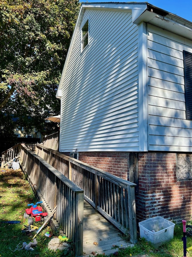 view of side of property featuring fence