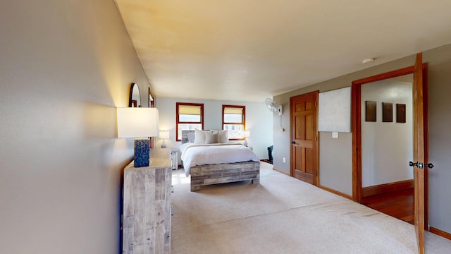 carpeted bedroom with baseboards