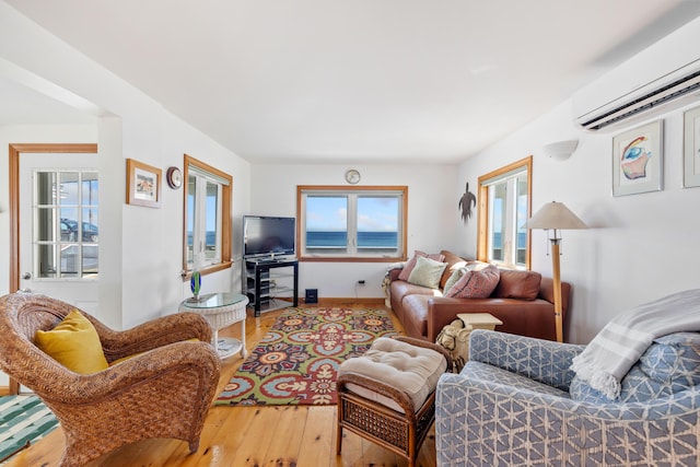 347 Webhannet Dr, Wells, ME 04090 - living room featuring wood-type flooring and a wall unit AC