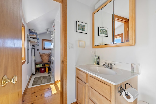 347 Webhannet Dr, Wells, ME 04090 - bathroom with vanity, hardwood / wood-style flooring, and vaulted ceiling