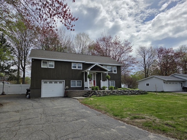134 Minuteman Dr, Millinocket, ME 04462 - raised ranch featuring asphalt driveway and a garage